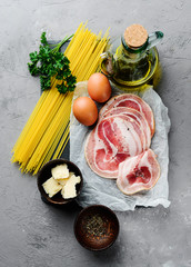 Traidtional Italian Pasta Carbonara Ingredients: Bacon, Spaghetti, Parmesan and pecorino cheese, egg
