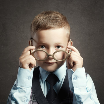 funny child in glasses and siut.genius Kids