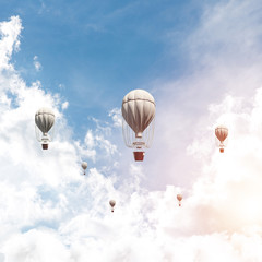 Flying hot air balloons in the air.