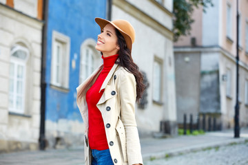 Beautiful woman in autumn style in town. Fashionable concept