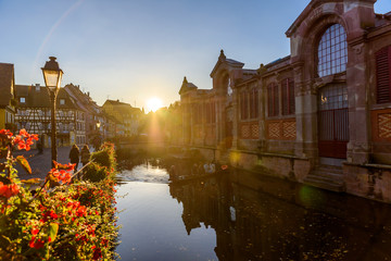 Beautiful view of the historic town of Colmar, also known as Little Venice, boat ride along traditional colorful houses on idyllic river Lauch in summer, Colmar, Alsace, France