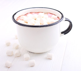 A cup with cocoa and marshmallow on a white background.