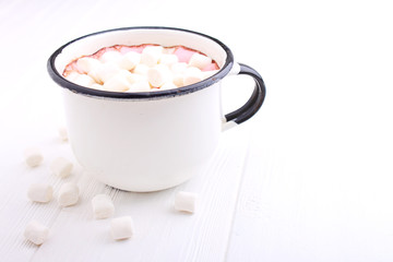 A cup with cocoa and marshmallow on a white background.