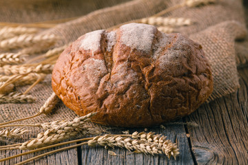 ears of rye on rustic wooden table