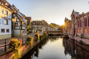 Foto op Canvas Beautiful view of the historic town of Colmar, also known as Little Venice, boat ride along traditional colorful houses on idyllic river Lauch in summer, Colmar, Alsace, France © Simon Dannhauer
