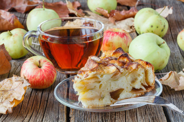 Hot tea with apple in autumn day