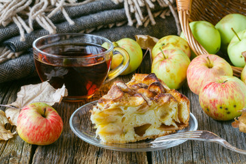 Sweet apple pie with hot tea in cup