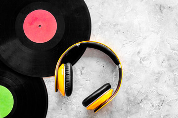 Compose music. Vinyl records, headphones, music notes on grey background top view copyspace