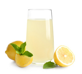 Glass of fresh lemon juice on white background