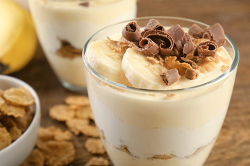 Glass with delicious banana pudding, close up
