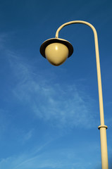 Urban lamp against the sky.