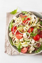 spiralized courgette salad greek style with tomato feta olives cucumber