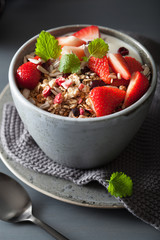 granola and yogurt with seeds and strawberry for breakfast