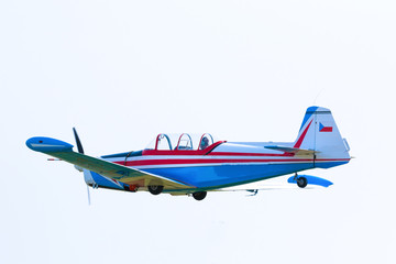 Propeller plane in flight in sky in sunny day, Prague