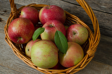 Red ripe apples in a basket
