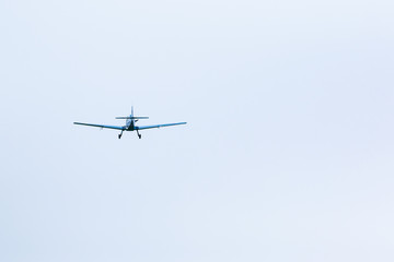 Propeller plane in flight in sky in sunny day, Prague
