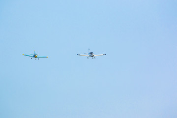 Two Propeller planes in flight in sky in sunny day, Prague
