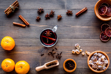 Merry christmas in winter evening with warm drink. Hot mulled wine or grog with fruits and spices...