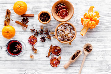 Ingredients mulled wine or grog with spices and citrus for winter evening. Christmas new year eve. Wooden background top view.