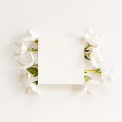 white fabric mock-up with blooming flowers and leaves.