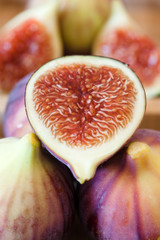 Fresh figues in wooden bowl, close up