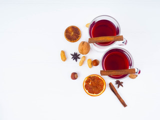 christmas hot mulled wine with cinnamon cardamom and anise on wooden background