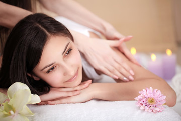 Fototapeta na wymiar Masseur doing massage on woman body in the spa salon. Beauty treatment concept.
