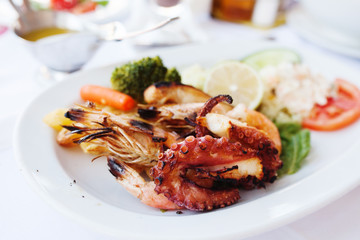 Fresh mixed seafood plate with vegetables