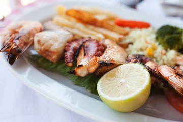 Fresh mixed seafood plate with vegetables