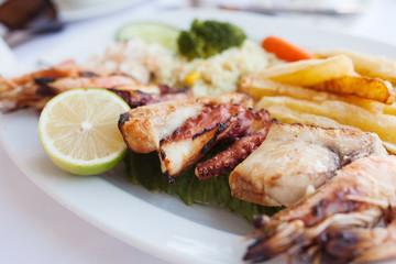 Fresh mixed seafood plate with vegetables