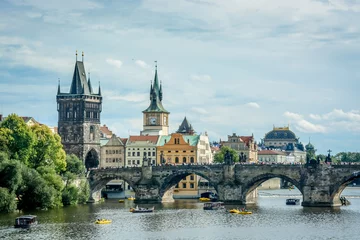 Tuinposter View of the Vitava River and The Charles Bridge in Prague Czech Republic © Mark