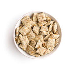 Breakfast cereal squares in bowl.