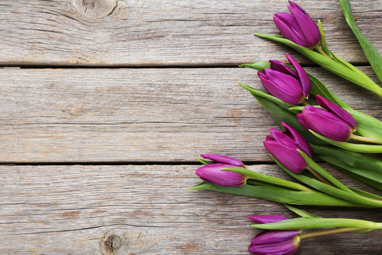 Fototapeta Bouquet of tulips on a grey wooden table