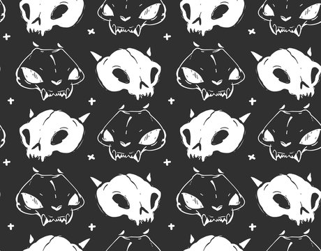 Hand drawn vector abstract artistic freehand textured ink seamless pattern with cat skulls isolated on black background.