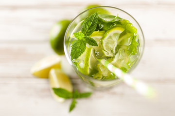 Mojito cocktail on white wood background