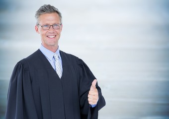 Male judge thumbs up against blurry blue wood panel