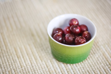 Red grapes in the green bowl