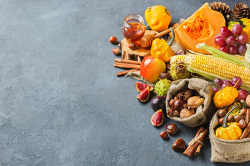 Fall autumn harvest thanksgiving background with pumpkin apple chestnut corn