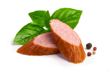 Smoked sausages with basil and spices, isolated on white background