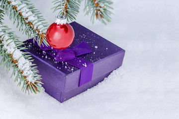 Christmas still life on white snow, Christmas tree gifts and balls