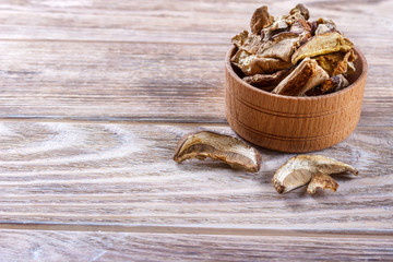 dried porcini mushroom on a wooden table