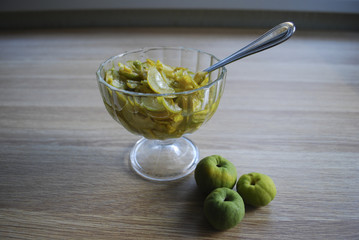 Jam from slices of Chaenomeles japonica (known as Maule's quince) green and yellow fruits in the...