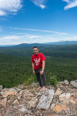 Naklejka na ściany i meble Man stay in a peak in Ural mountains
