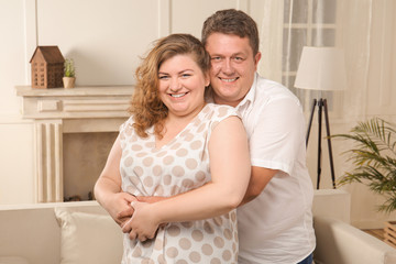 Overweight couple at home