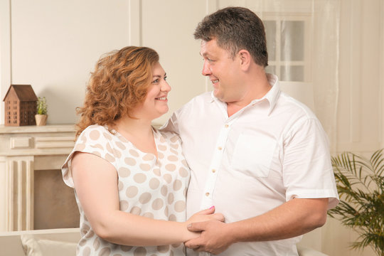 Overweight couple at home