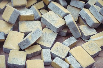 scattered yellow paving slabs, construction of a pedestrian walkway