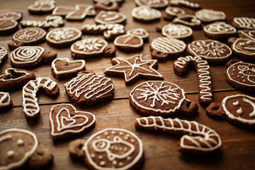 Traditional homemade Christmas ginger and chocolate cookies decorated with white sugar painting