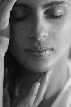 Portrait of a beautiful woman with freckles