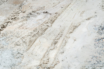 Vehicle tires tracks in the muddy ground