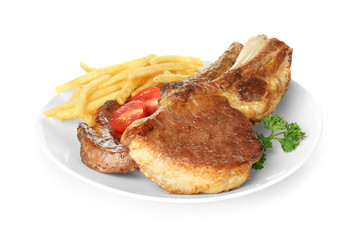 Plate with delicious grilled ribs and garnish isolated on white